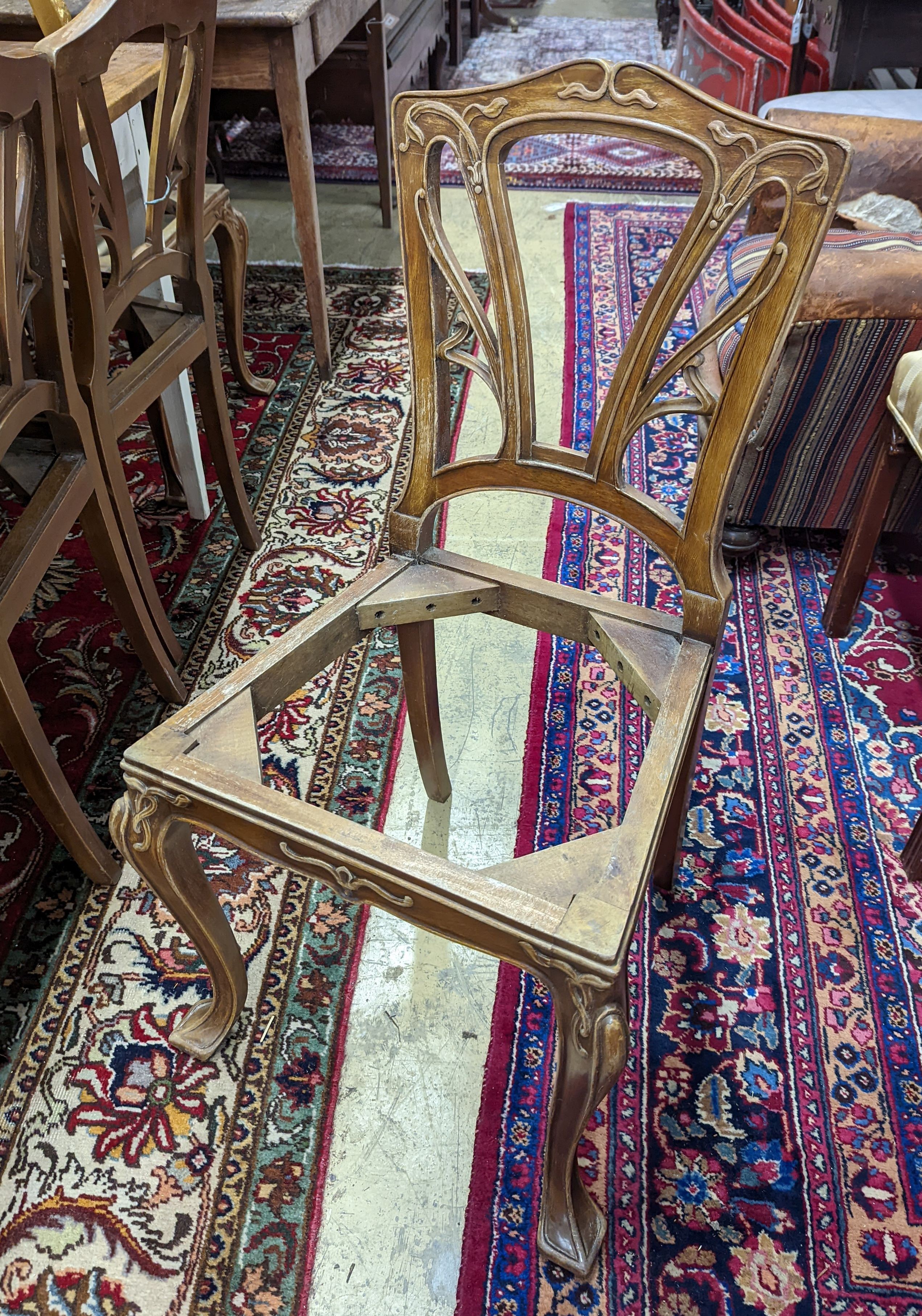 A set of six Majorelle style mahogany dining chairs (no seats). H-92cm.
